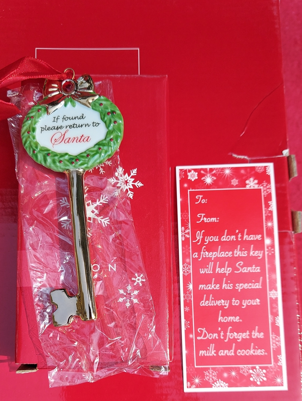 Avon Green and Gold 'Please Return to Santa' Key Ornament with Red Ribbon